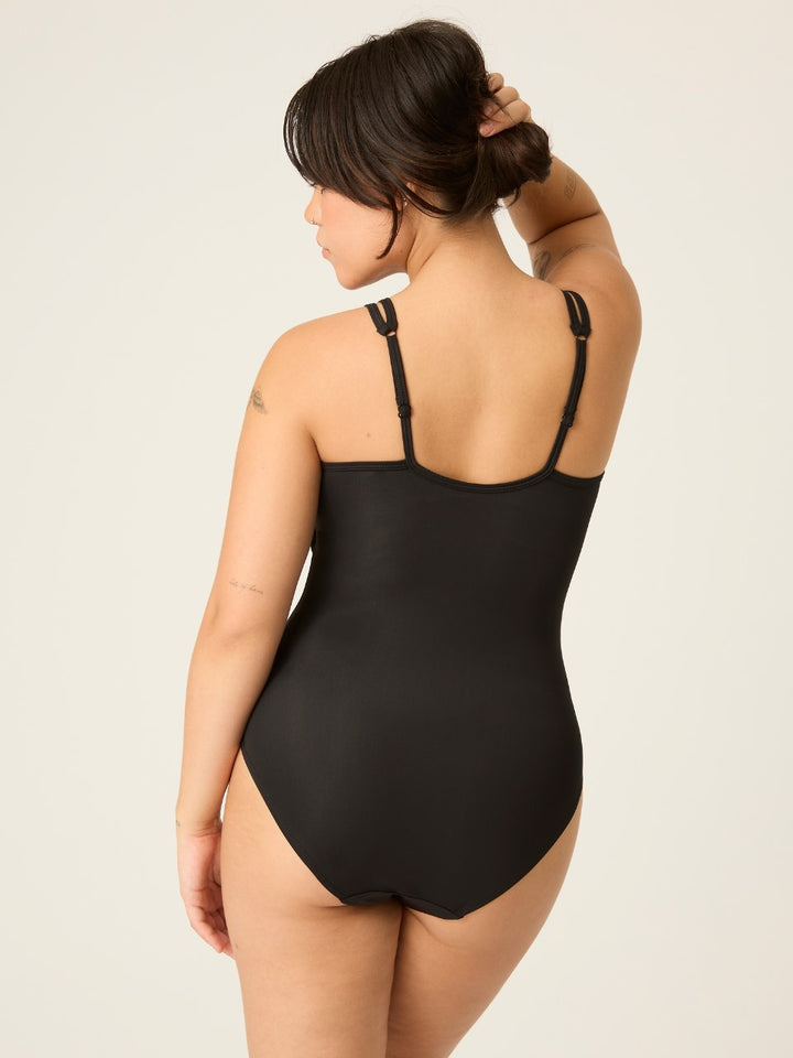 Modibodi Period Swimwear one Piece, black, Back View. Dive back into pool parties in this classic one-piece swimsuit, made from an innovative recycled fabric with our hi-tech, fast-drying absorbent lining. It’s the perfect pair to hit the beach – without fear of leaks.