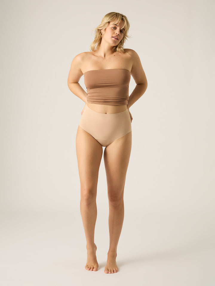 Modibodi Seamfree full brief moderate-heavy period underwear in Cashew, front view. Perfect for your heaviest days, or all night long, with a seamless, comfortable fit. Perfect for heavy flow days and nights, featuring advanced leak-proof technology and a sleek, invisible design under clothing.