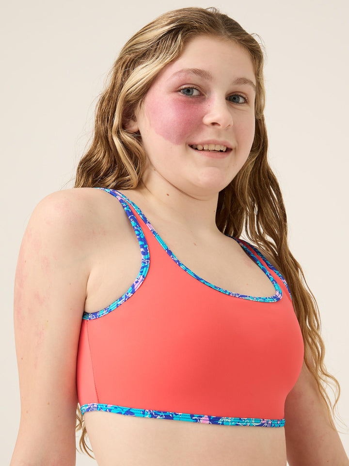 Modibodi Teen Swimwear Crop Top. This playful bikini top is designed for growing teen bodies and made to be fast-drying and chlorine-resistant. Size 12-14.